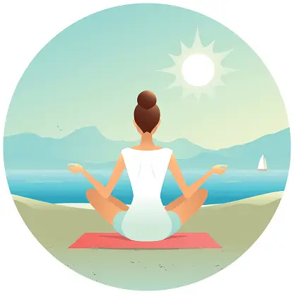Young woman doing yoga on the beach in the morning, rear view.